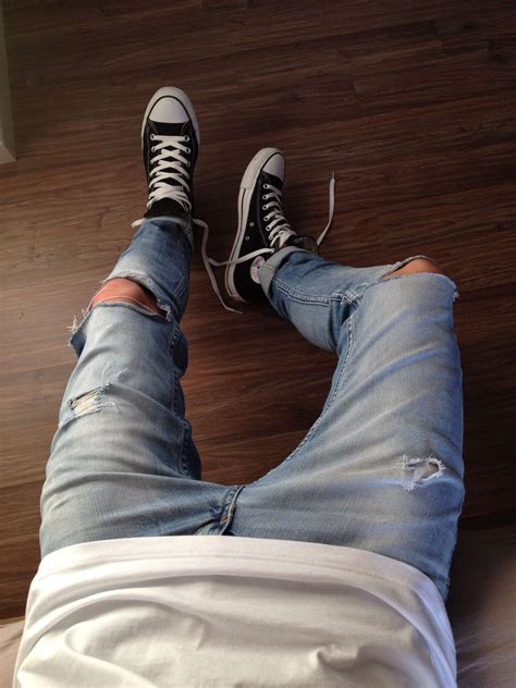 converse and ripped jeans.